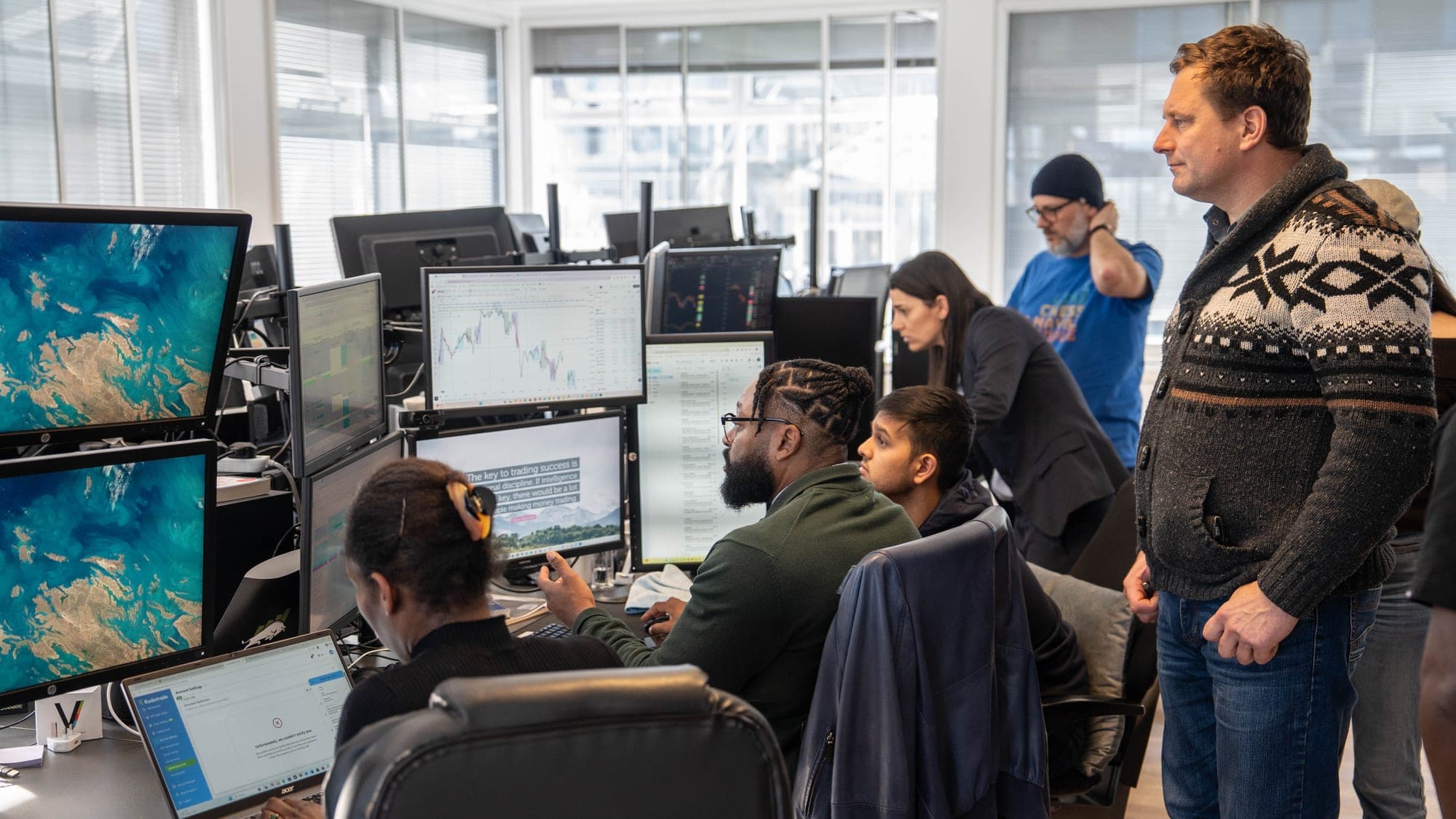 Traders working on the FMO live trading floor in the City of London
